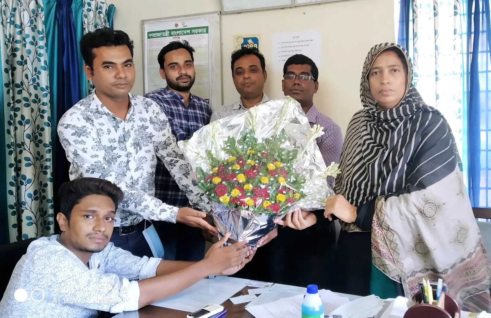 Anik Mahmud receiving recognition from Kushtia District Social Services officials in October 2020.