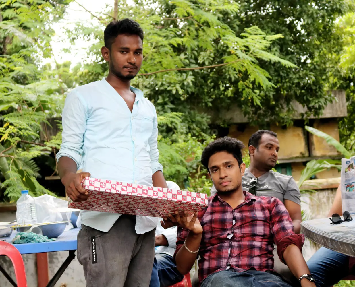 Anik Mahmud with Md Sagor Islam and participants at the 2019 Shutterstock picnic at Poradah Degree College.