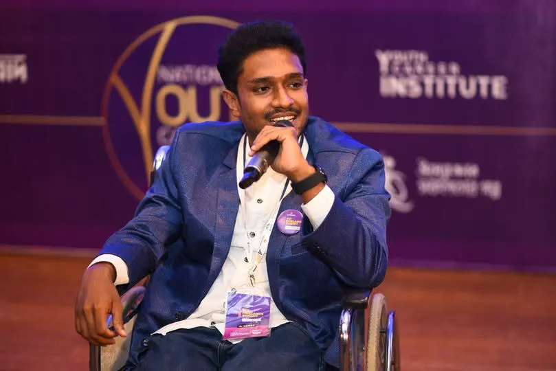 Anik Mahmud speaking on the Rising Youth programme stage in 2023.