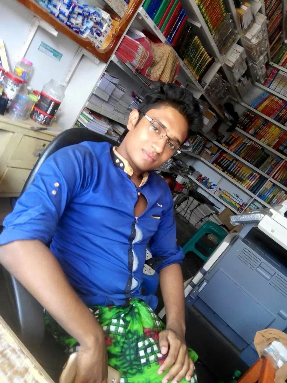 Anik Mahmud inside his shop during the period when he began learning digital design in 2016.