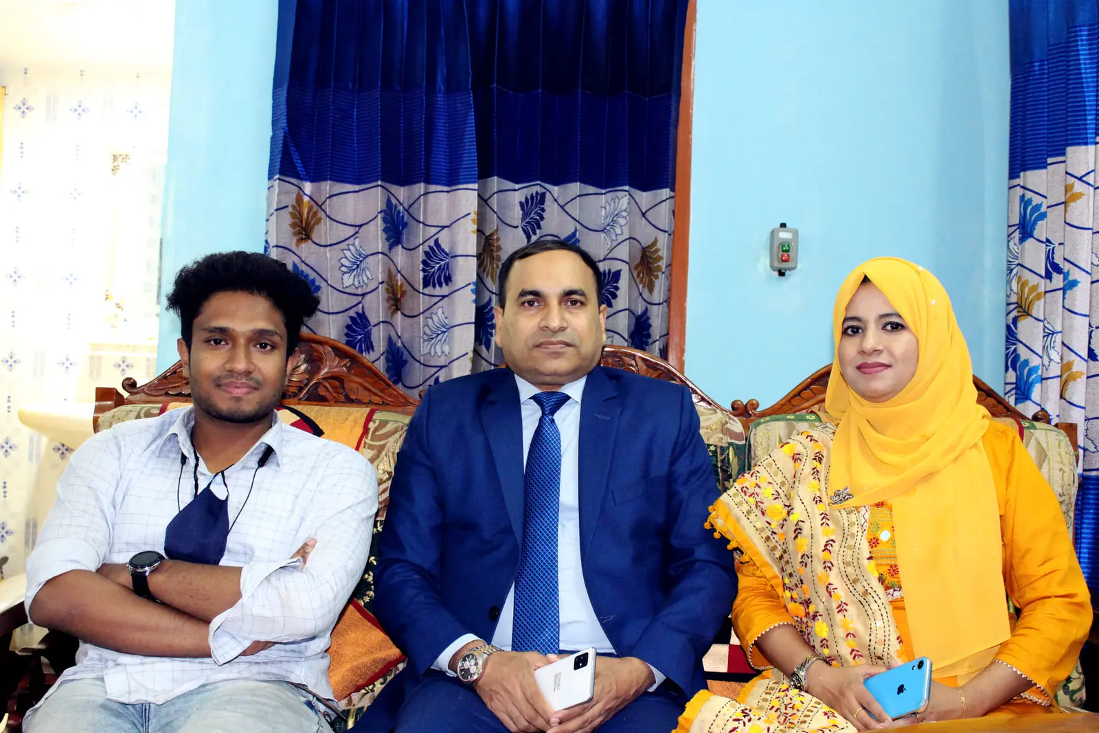 Anik Mahmud with District Judge Md Zahidul Islam and Lipi Khatun during a 2022 visit.