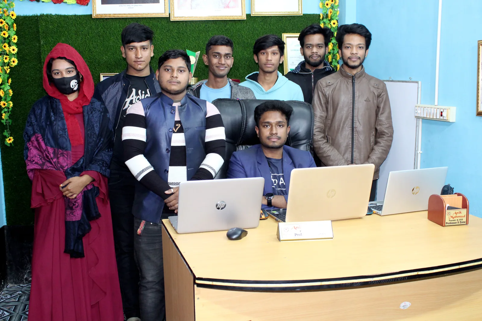 Anik Mahmud with members of the Professor IT Zone team in the office.