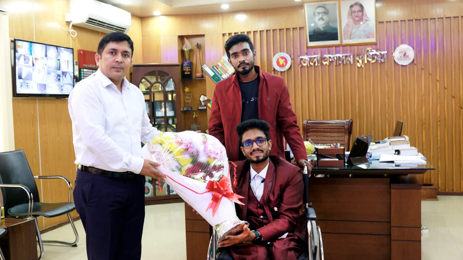 Anik Mahmud at the Kushtia Deputy Commissioner’s office discussing disability inclusion and digital work.